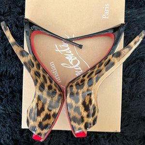 Christian Louboutin leopard peep toe heels .